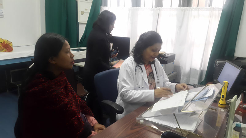 Doctor consulting with a patient at the office desk